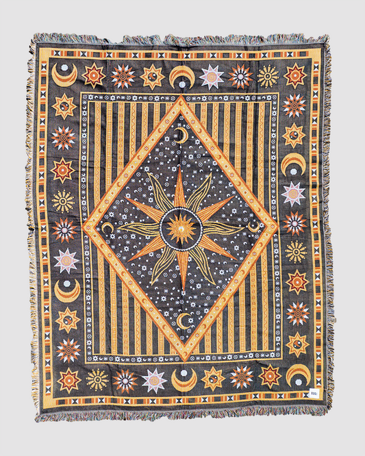 Astral Plane throw featuring celestial patterns in black and yellow