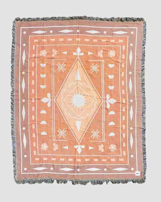 Slow Burn throw rug with gradient red tones, machine-washable recycled cotton