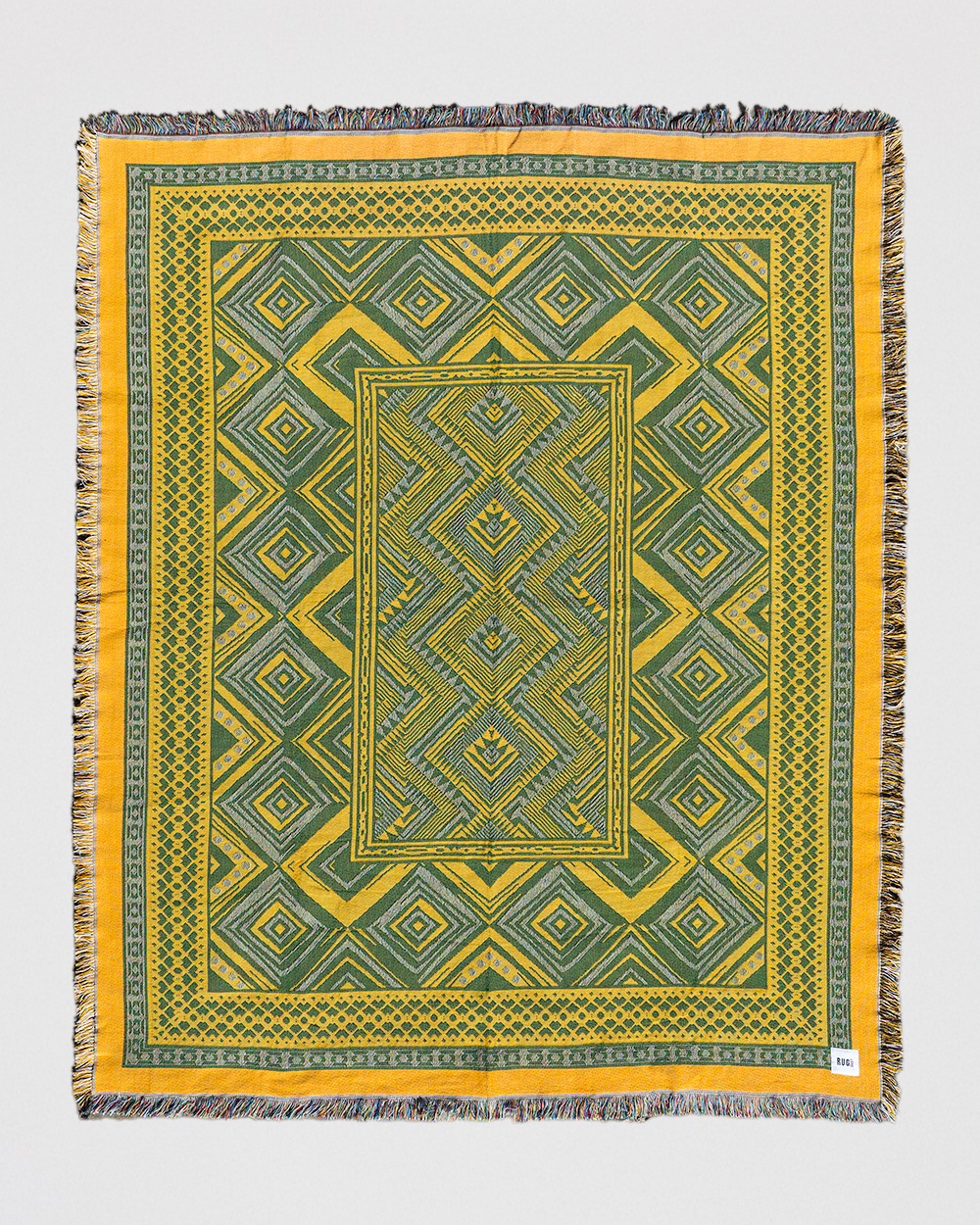 Verdant Haze woven picnic throw in green and yellow, made from 100% recycled cotton