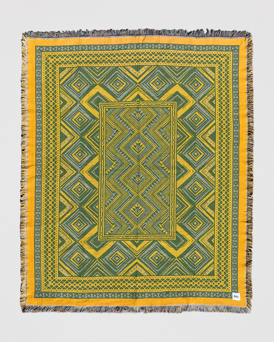 Verdant Haze woven picnic throw in green and yellow, made from 100% recycled cotton